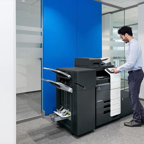 man-in-office-near-printer